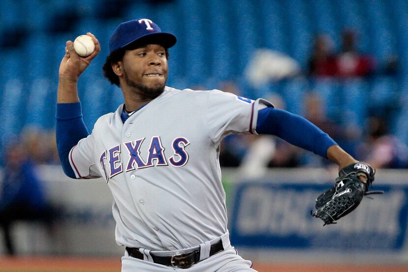 Neftali Feliz of the Texas Rangers pitches against the Toronto Blue Jays during MLB action...
