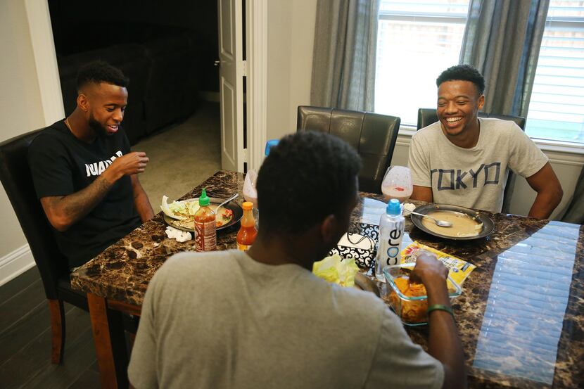 (From left) FC Dallas teammate Kellyn Acosta, Kris Reaves, and Jacori Hayes eat lunch in a...