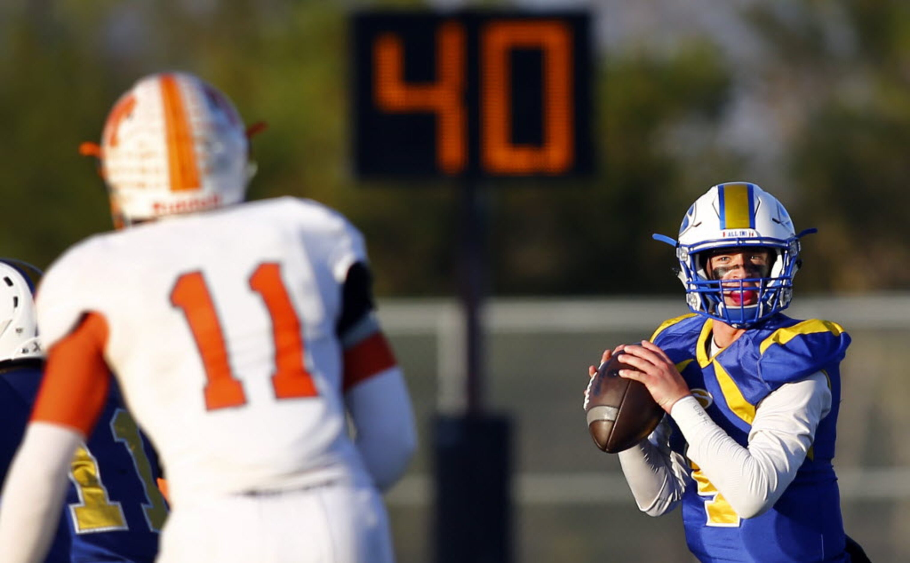 TXHSFB Sunnyvale's Patrick Spera (4) looks to pass as Mineola's Michael Drennon (11) plays...