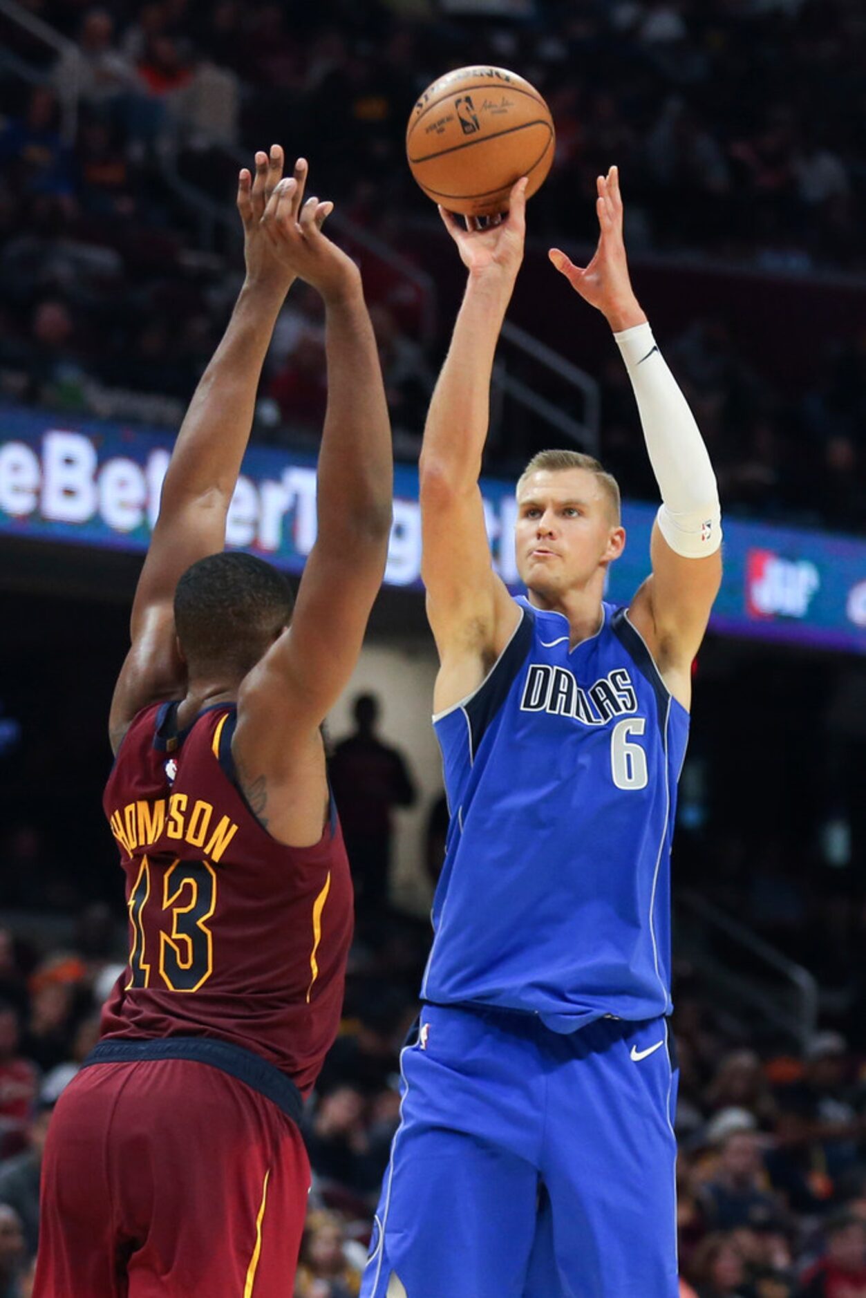 Dallas Mavericks' Kristaps Porzingis (6) shoots over Cleveland Cavaliers' Tristan Thompson...