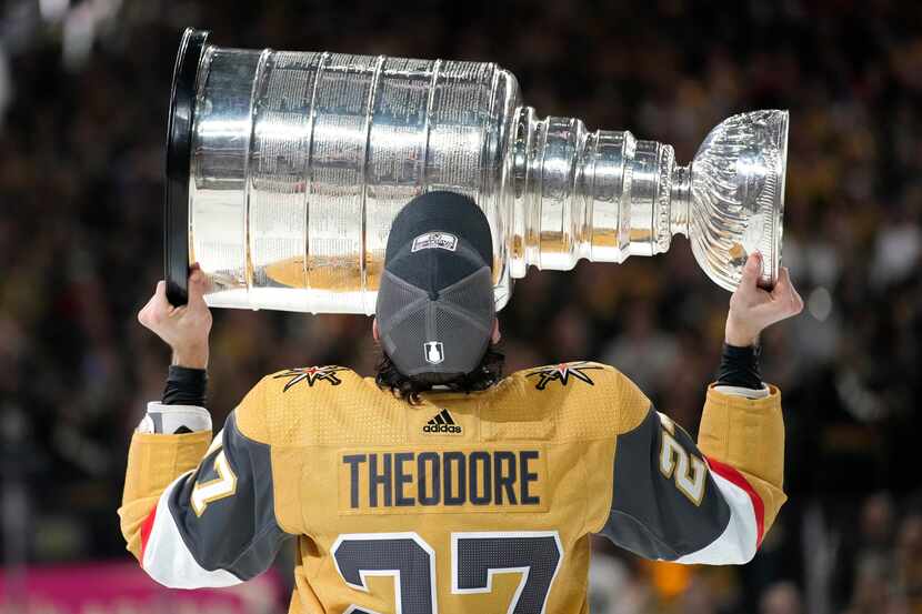 Vegas Golden Knights defenseman Shea Theodore skates with the Stanley Cup after the Knights...