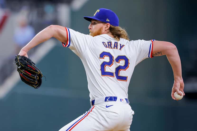 Texas Rangers starting pitcher Jon Gray delivers a pitch during the third inning of a...