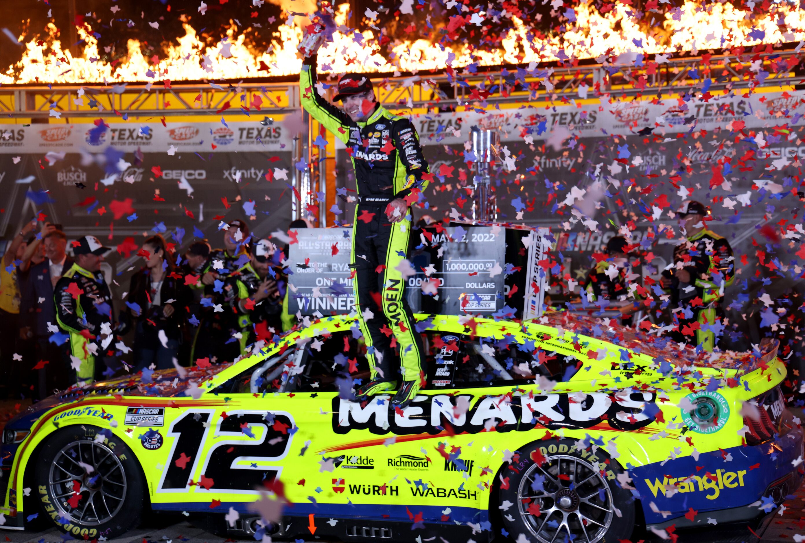 Ryan Blaney, driver of the #12 Menards / Wrangler Ford car, celebrates in the winner's...