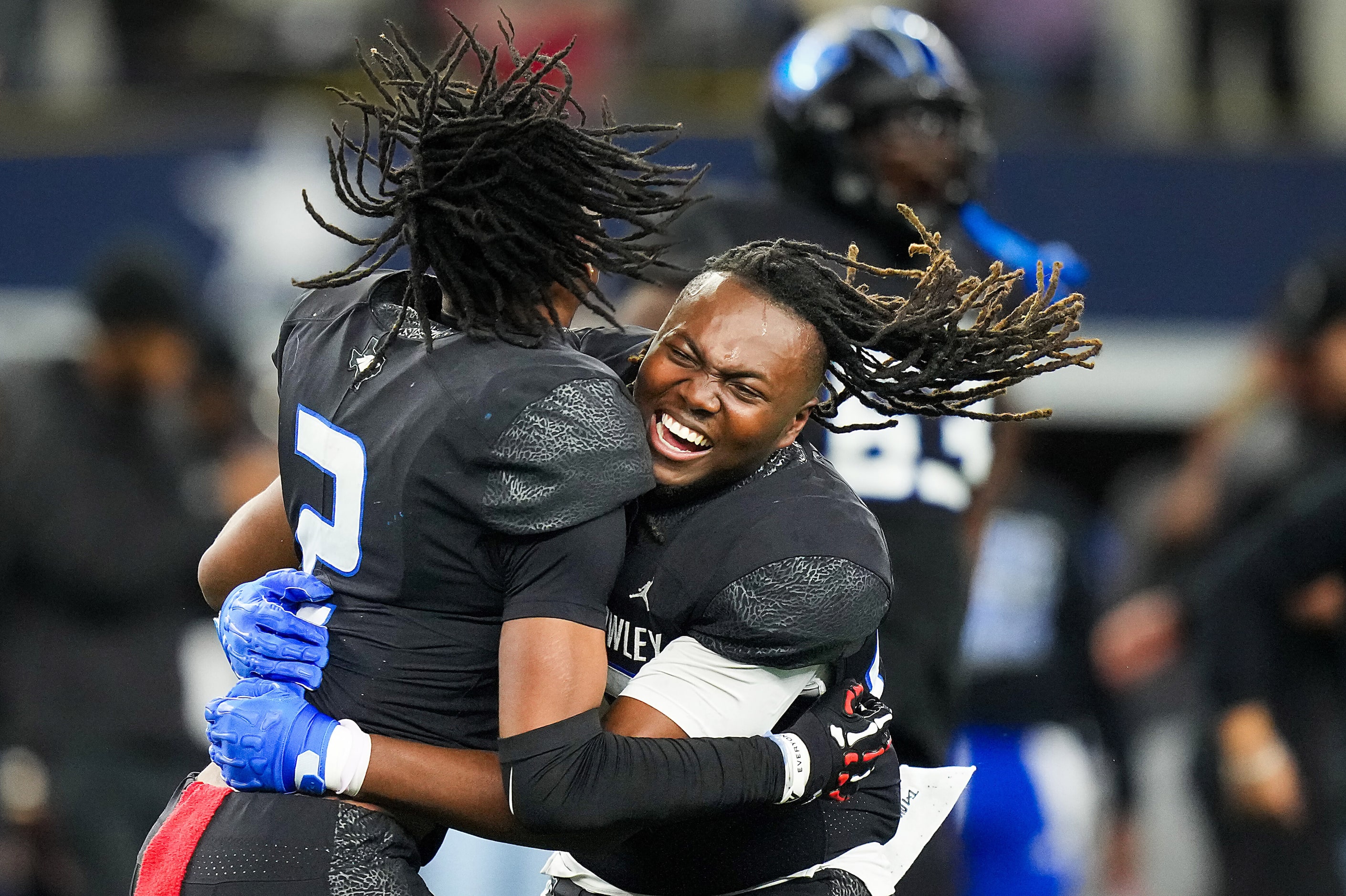 North Crowley tight end Jayden Shaw (facing) and linebacker Jonathan Cunningham (2)...