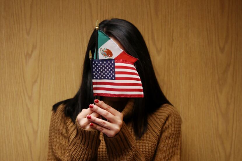 Diana, a "dreamer" from Mexico, poses with the flags of the countries she loves. Dreamers'...