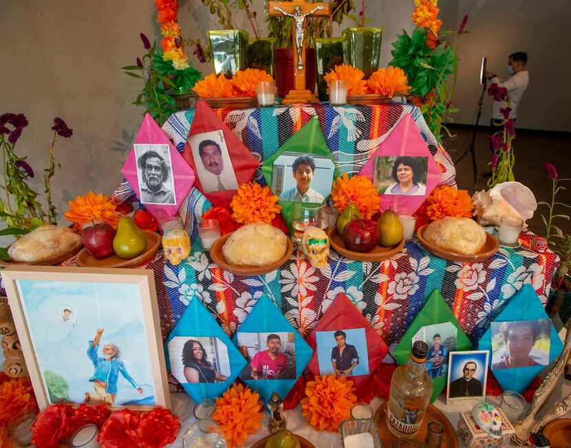 This Dia de Los Muertos altar by Pie de Lucha arts collective features a photo of the...