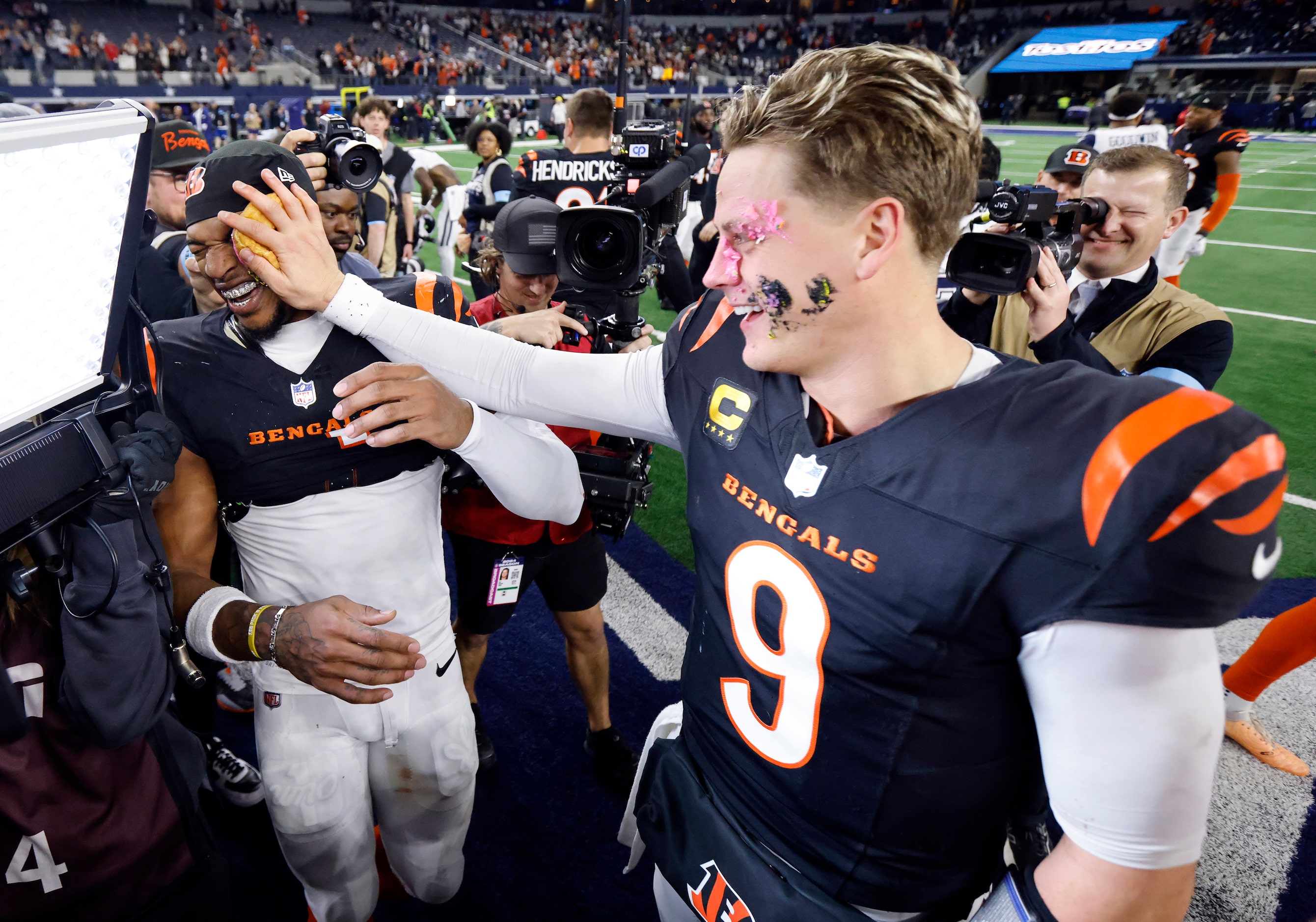 Cincinnati Bengals quarterback Joe Burrow returns the favor, smashing a Homer Simpson donut...