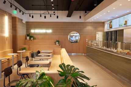 Salad shop Sweetgreen in Deep Ellum is designed in neutral tones. Just 22 people can sit...