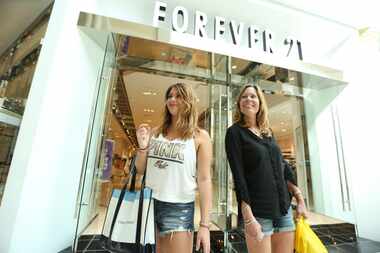  Emily, 20, and her mother Lara Dratch, of Allentown, Pa., shop at Forever 21 at the King of...
