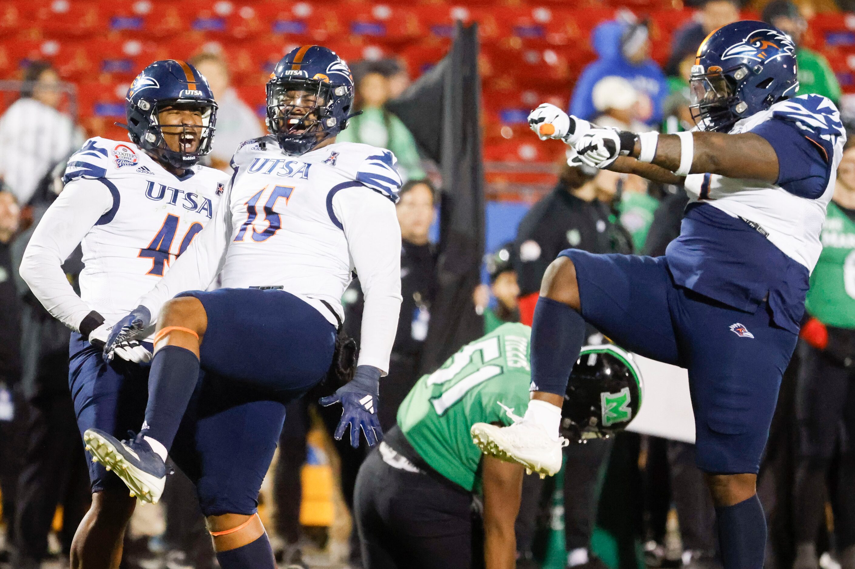 UTSA defensive lineman Trumane Bell II (15) celebrates with his teammates after sacking...