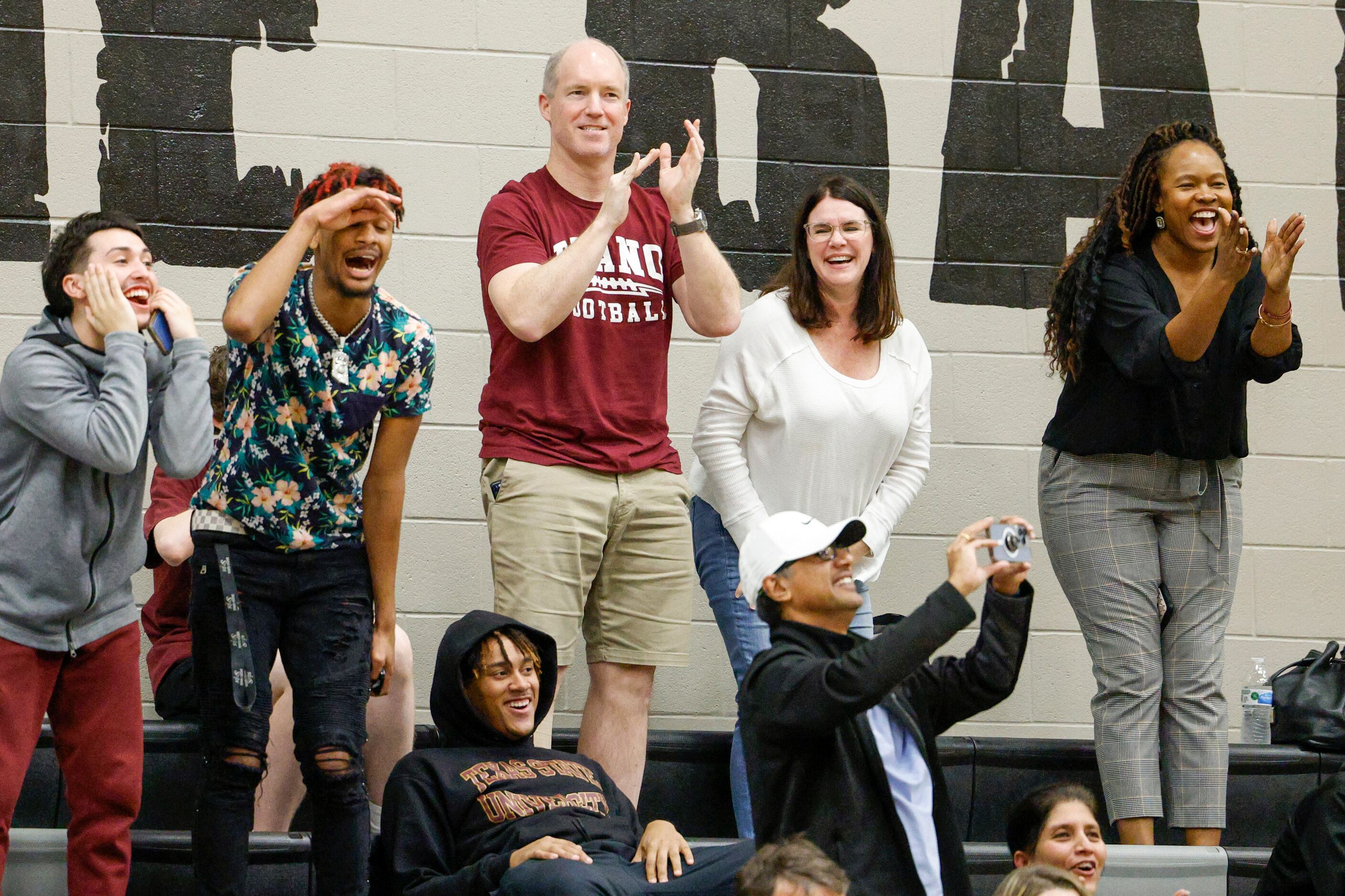 Plano fans celebrate a dunk during the second half of a non-district game against Frisco...