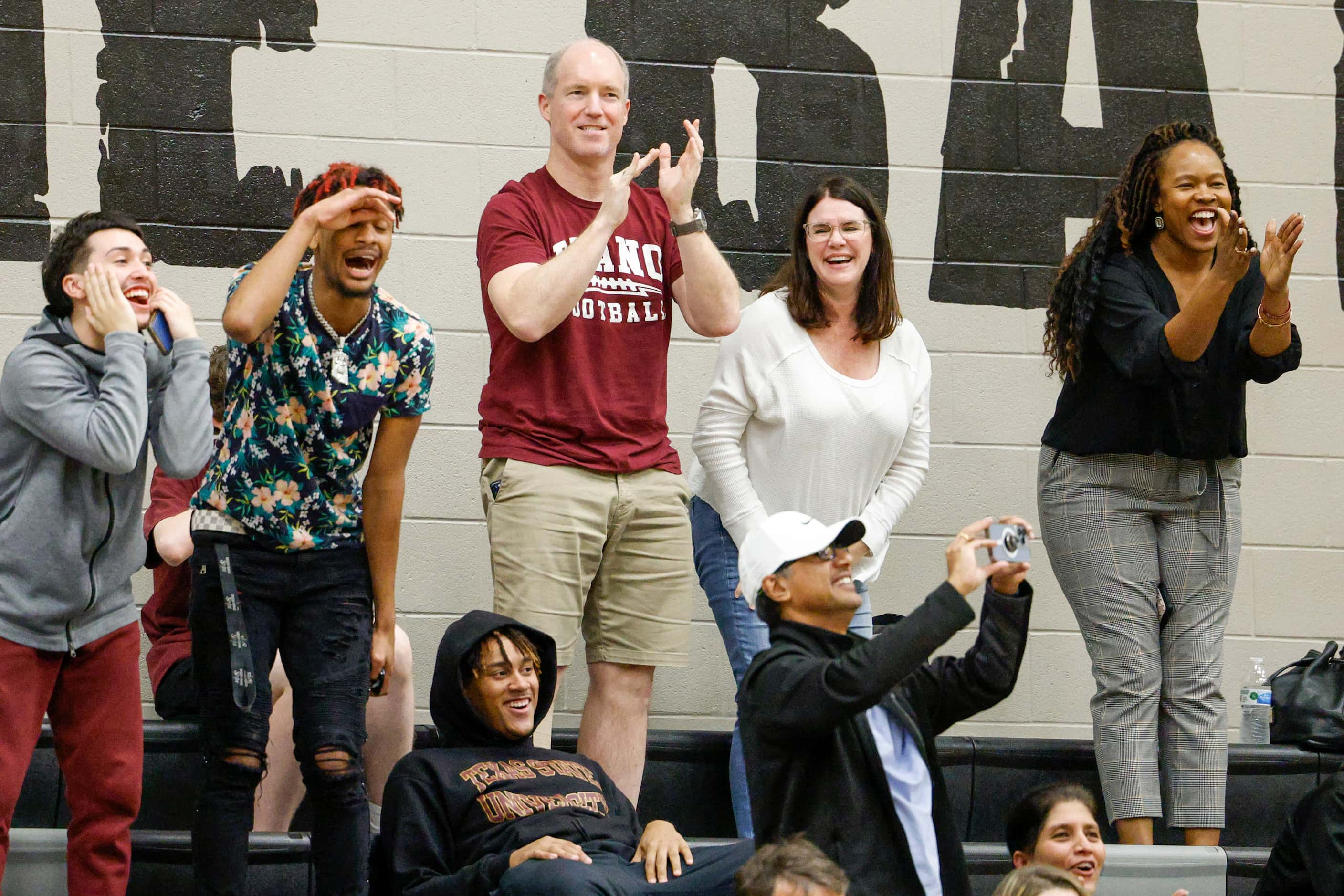 Plano fans celebrate a dunk during the second half of a non-district game against Frisco...