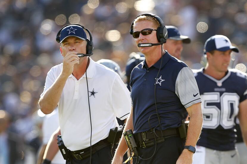 Dallas Cowboys head coach Jason Garrett (right) and offensive coordinator Scott Linehan are...