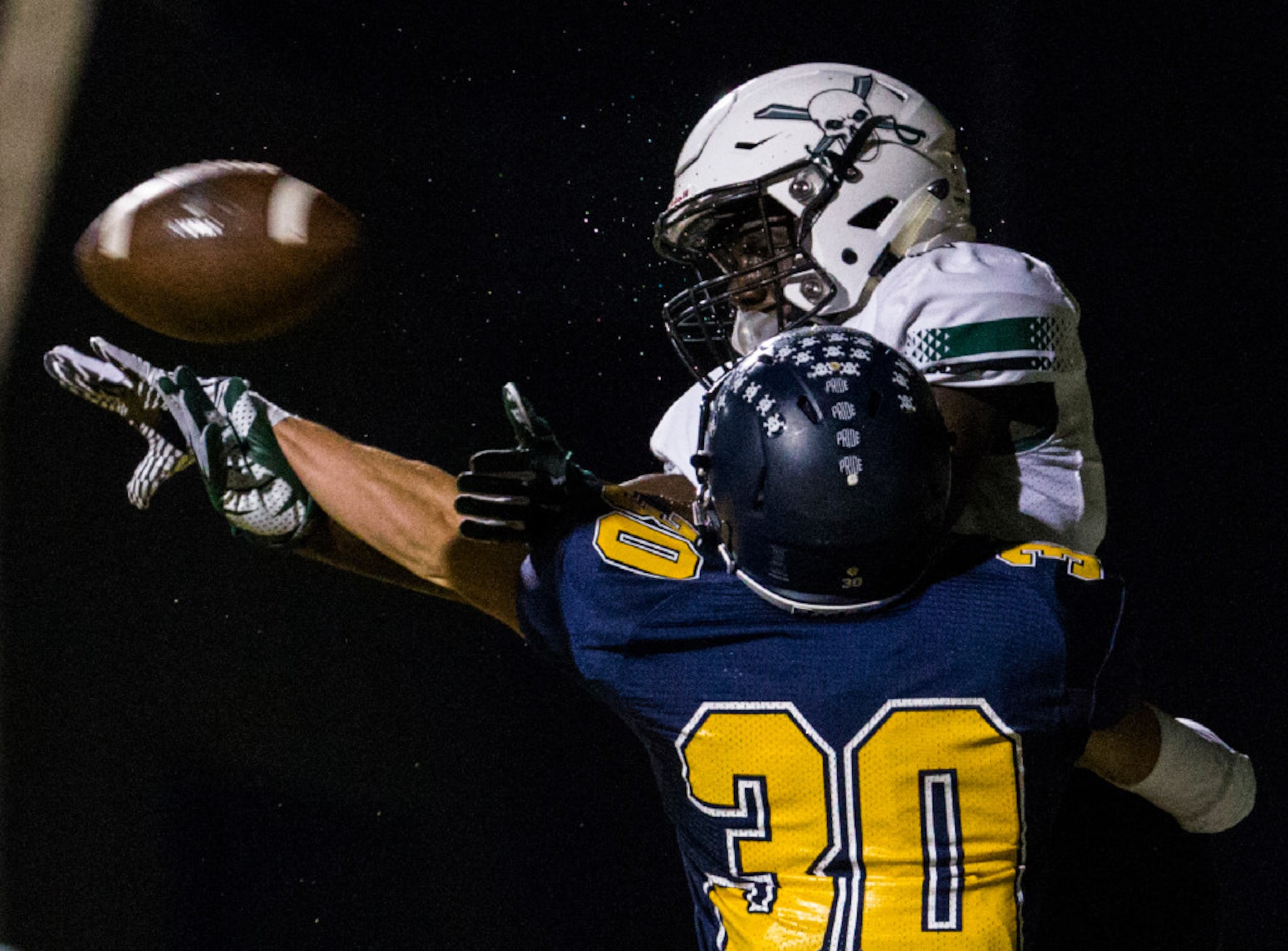 Highland Park defensive back James Herring (30) prevents Mesquite Poteet wide receiver Cha...