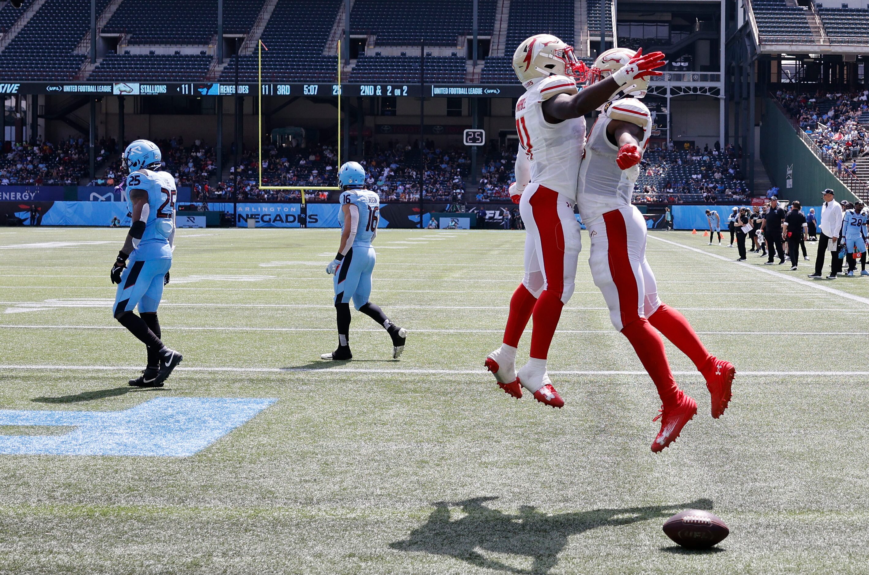 Birmingham Stallions running back Ricky Person Jr. (23), right, celebrates with his teammate...