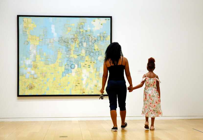 Angela Burton of Fort Worth and her daughter Ava Burton view artist Mark Bradford's "End...