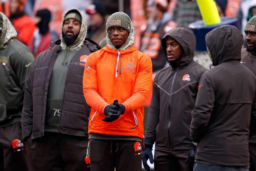 FILE - In this Nov. 19, 2017, file photo, Cleveland Browns' Josh Gordon, center, watches...