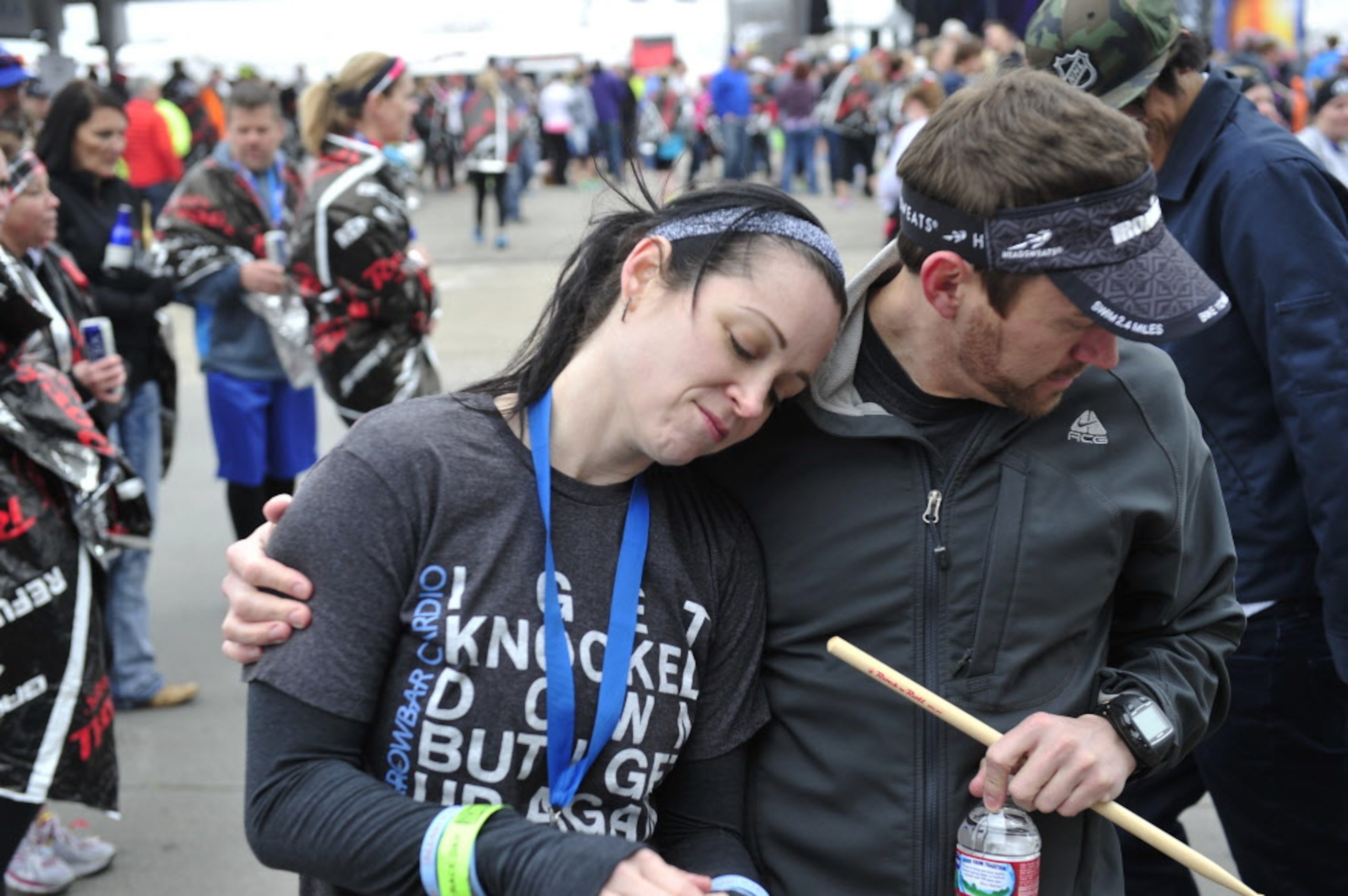 Karen Soltero (left) gets a hug from her boyfriend Greg Barnes after they finished walking...