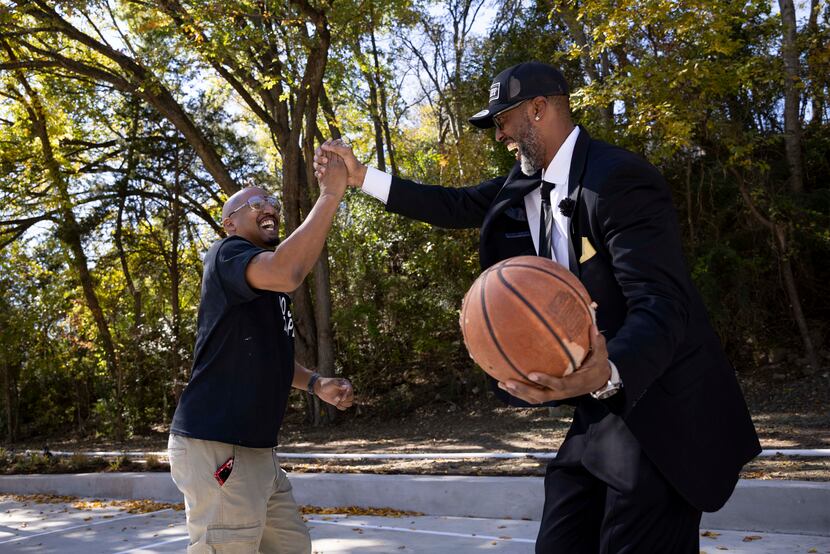 South Oak Cliff High School principal Willie Johnson (left) squared off with former NBA star...