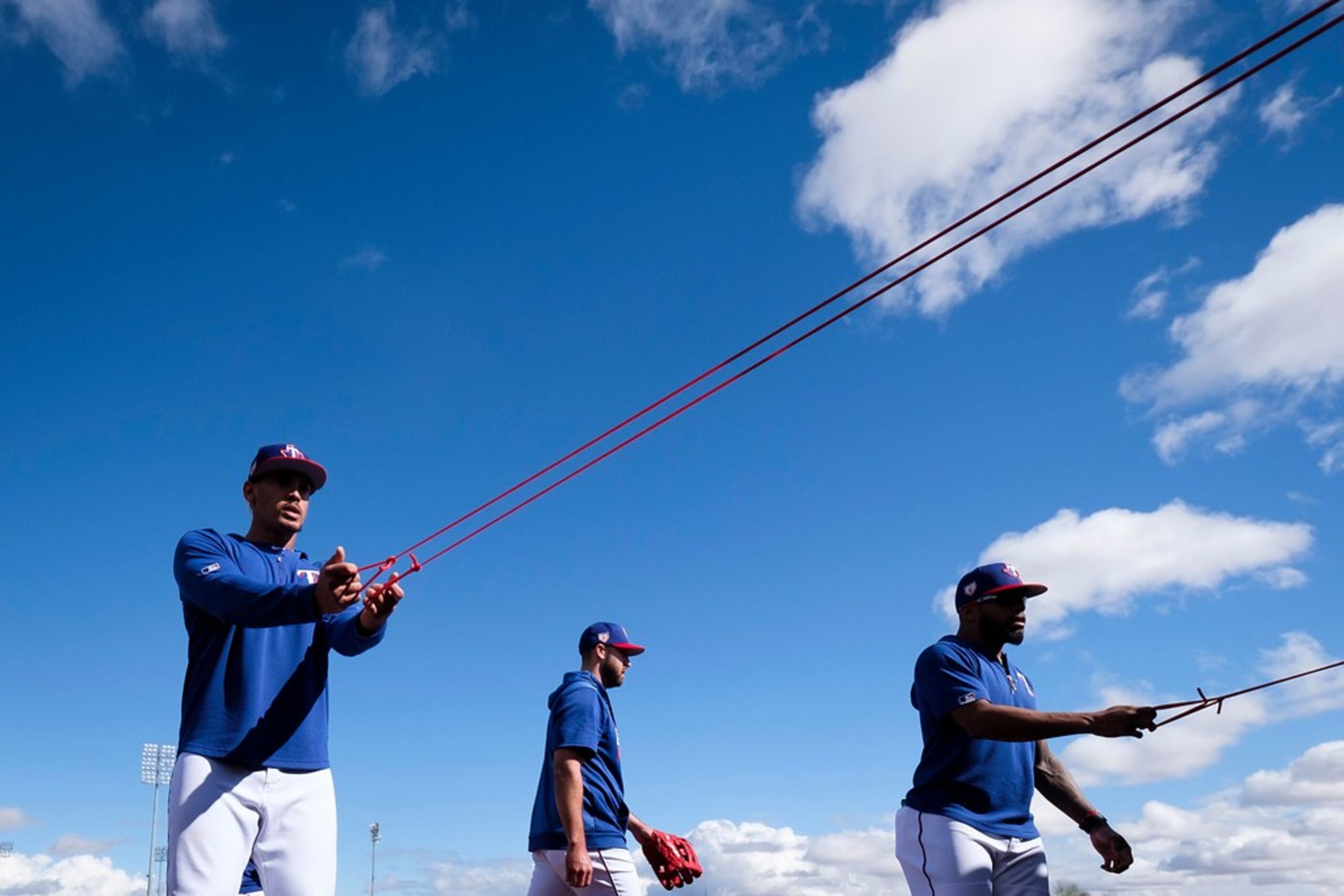 Texas Rangers infielder Ronald Guzman (left) outfielder Joey Gallo (center) and outfielder...