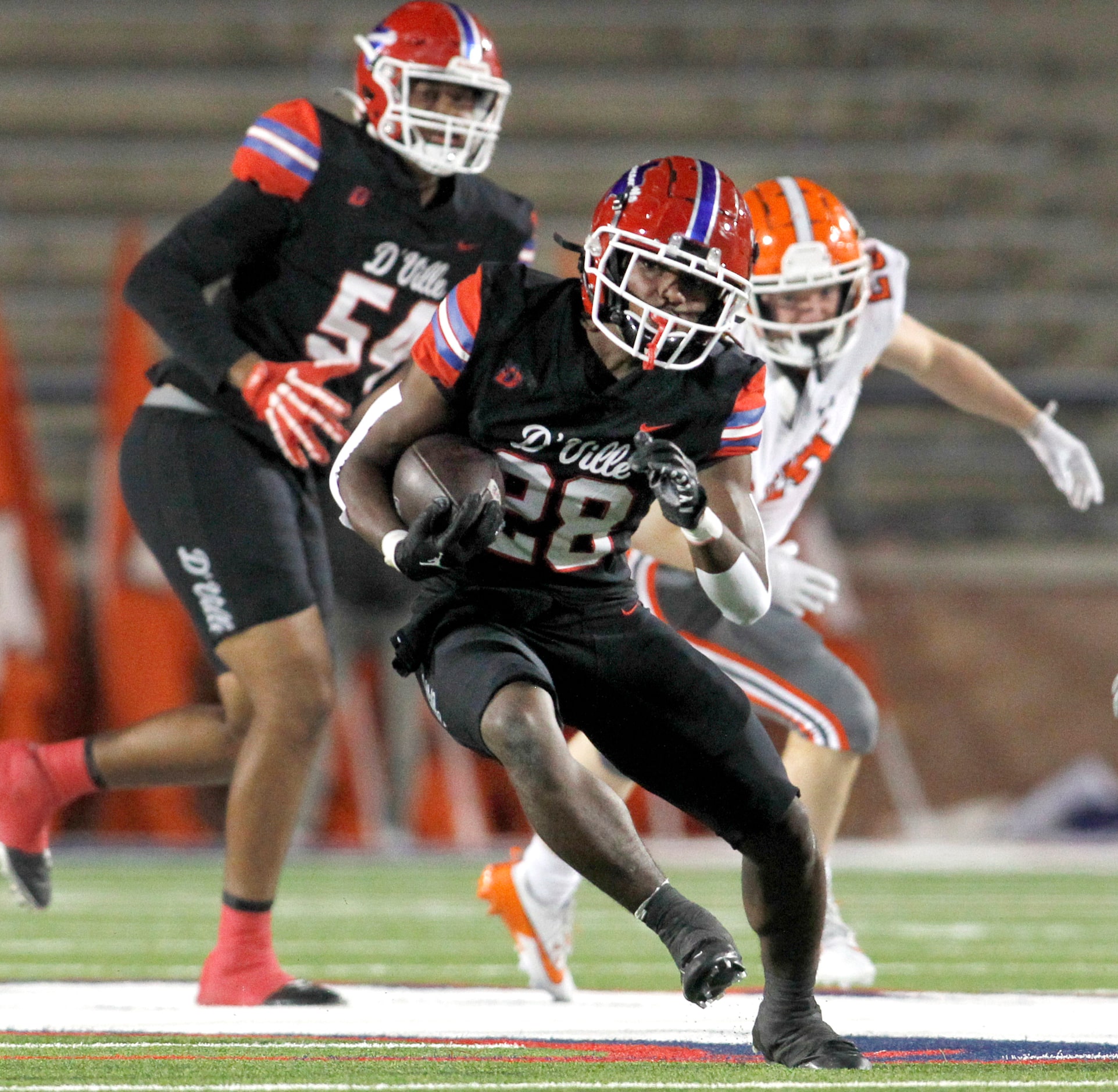 Duncanville running back Devine Green (28) breaks into the Rockwall secondary as he rushed...