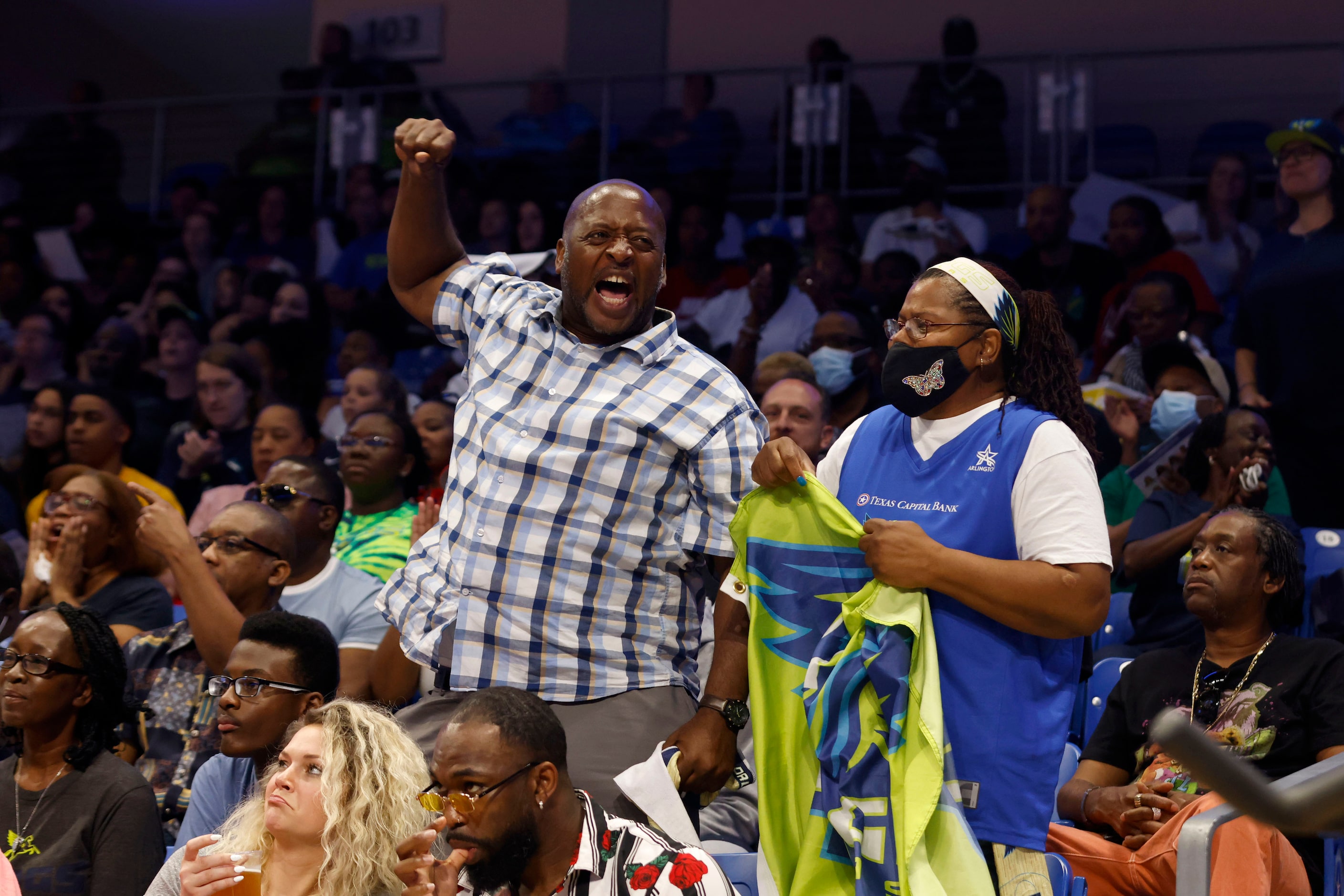 Dallas Wings fans Brian Davis and Terry Spivey of Dallas cheer as they played the Atlanta...