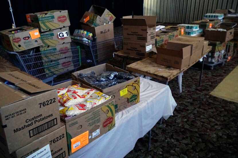Boxes of food pictured at Friendship West's ministry center on Kiest Boulevard in Dallas,...