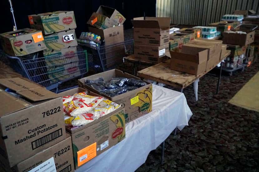 Boxes of food pictured at Friendship West's ministry center on Kiest Boulevard in Dallas,...