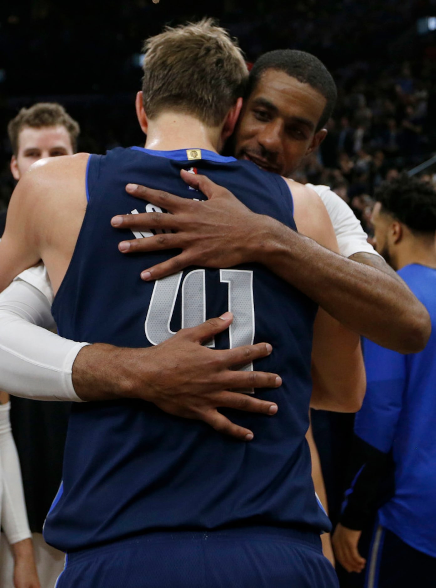 Dallas Mavericks forward Dirk Nowitzki (41) hugs San Antonio Spurs center LaMarcus Aldridge...