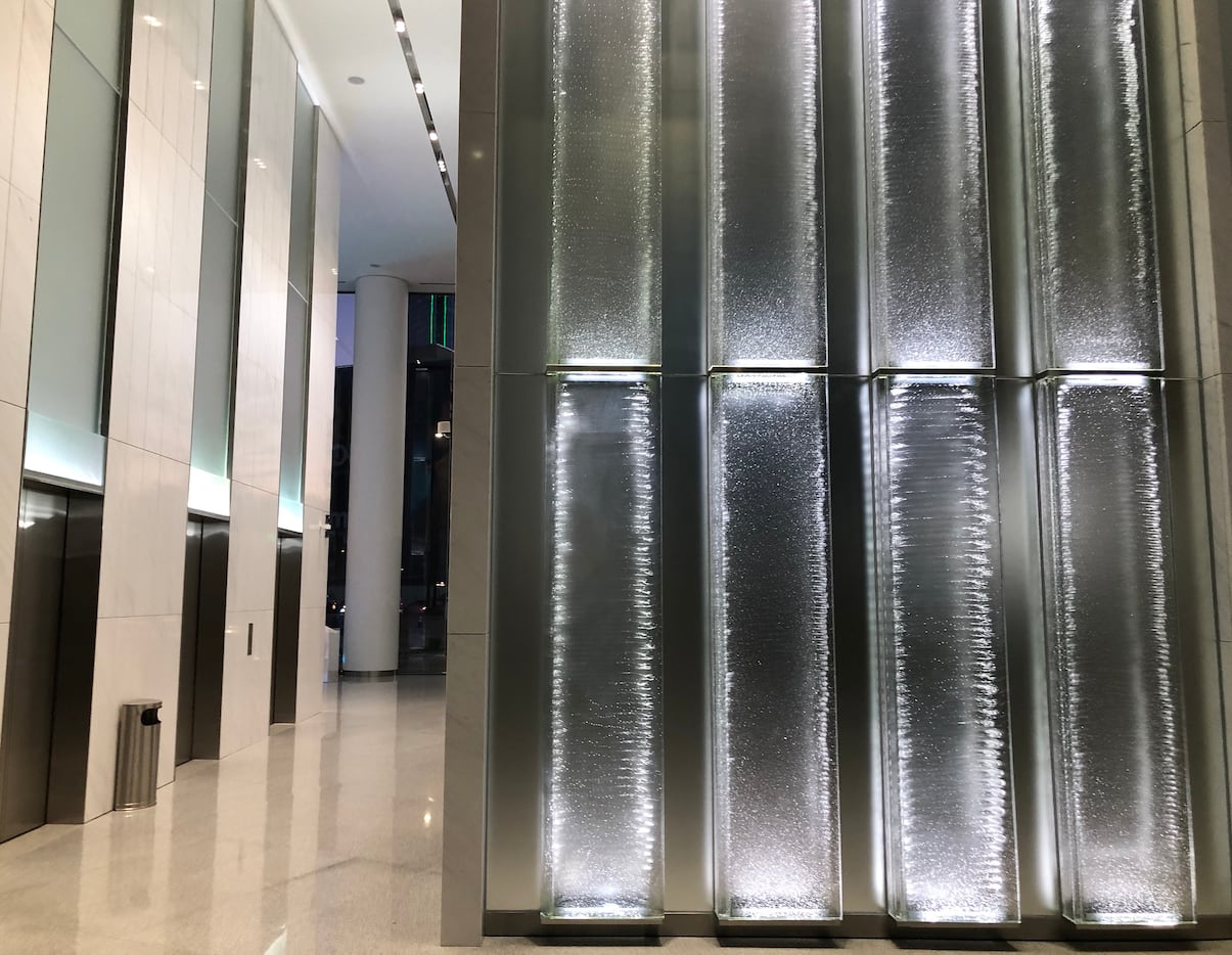 The most striking feature of the remodeling are yards of lighted glass panels in the lobby.