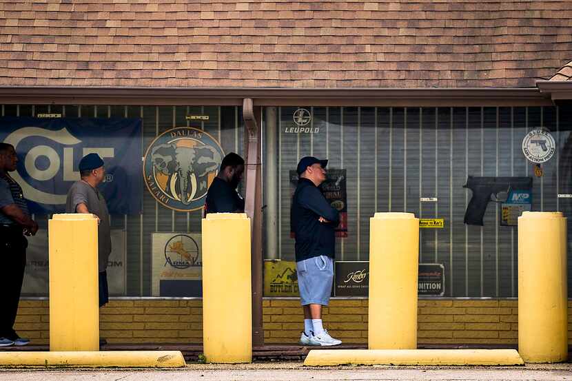 People lined up Thursday to get into Ray's Hardware and Sporting Goods, a gun shop on...