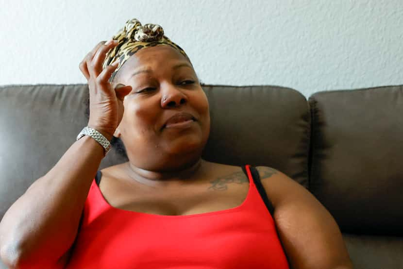 Schwana Jones wipes away tears as she talks about her nephew Zayvyon Jones during an...