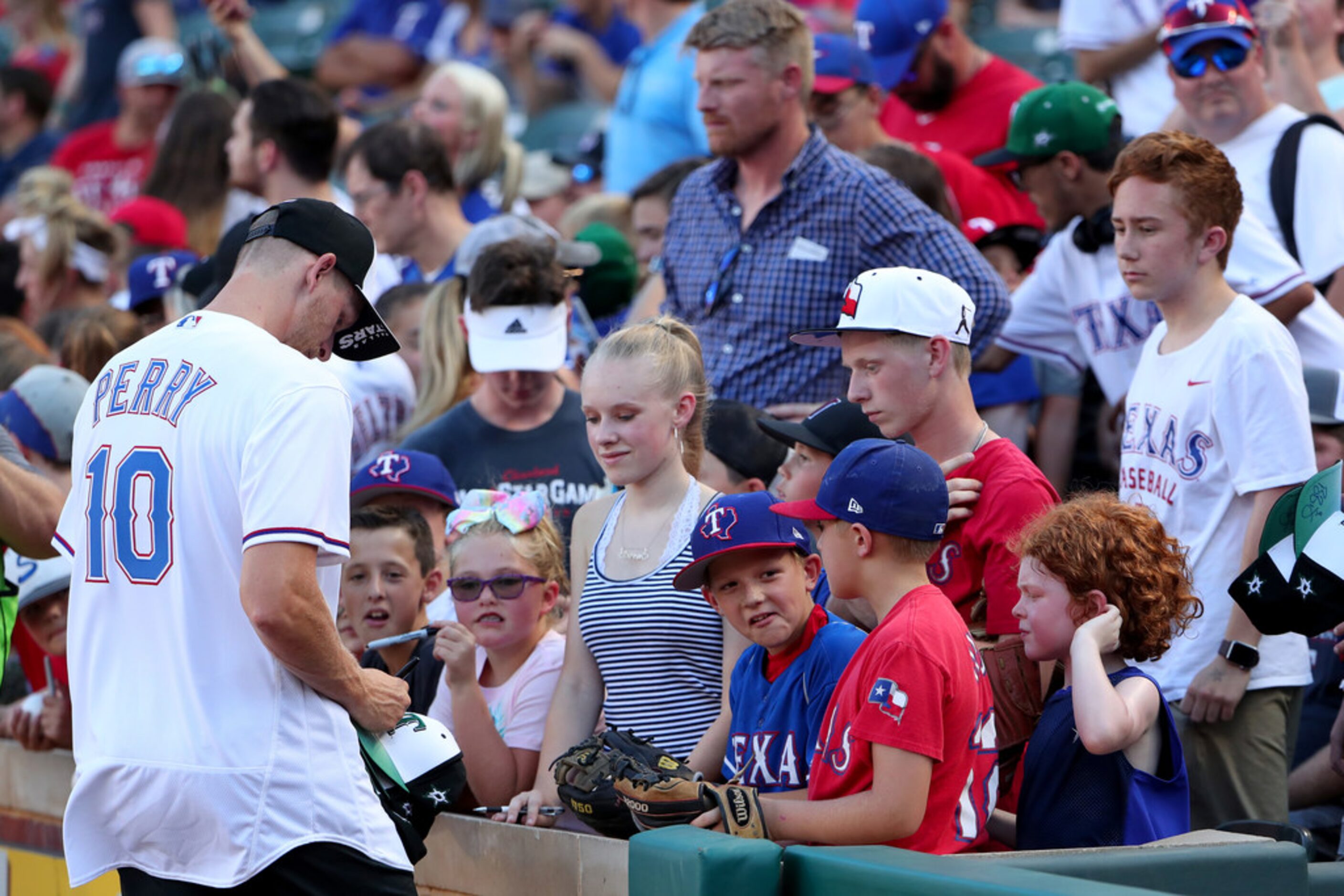 ARLINGTON, TEXAS - JULY 17: Corey Perry of the Dallas Stars signs autographs for fans before...