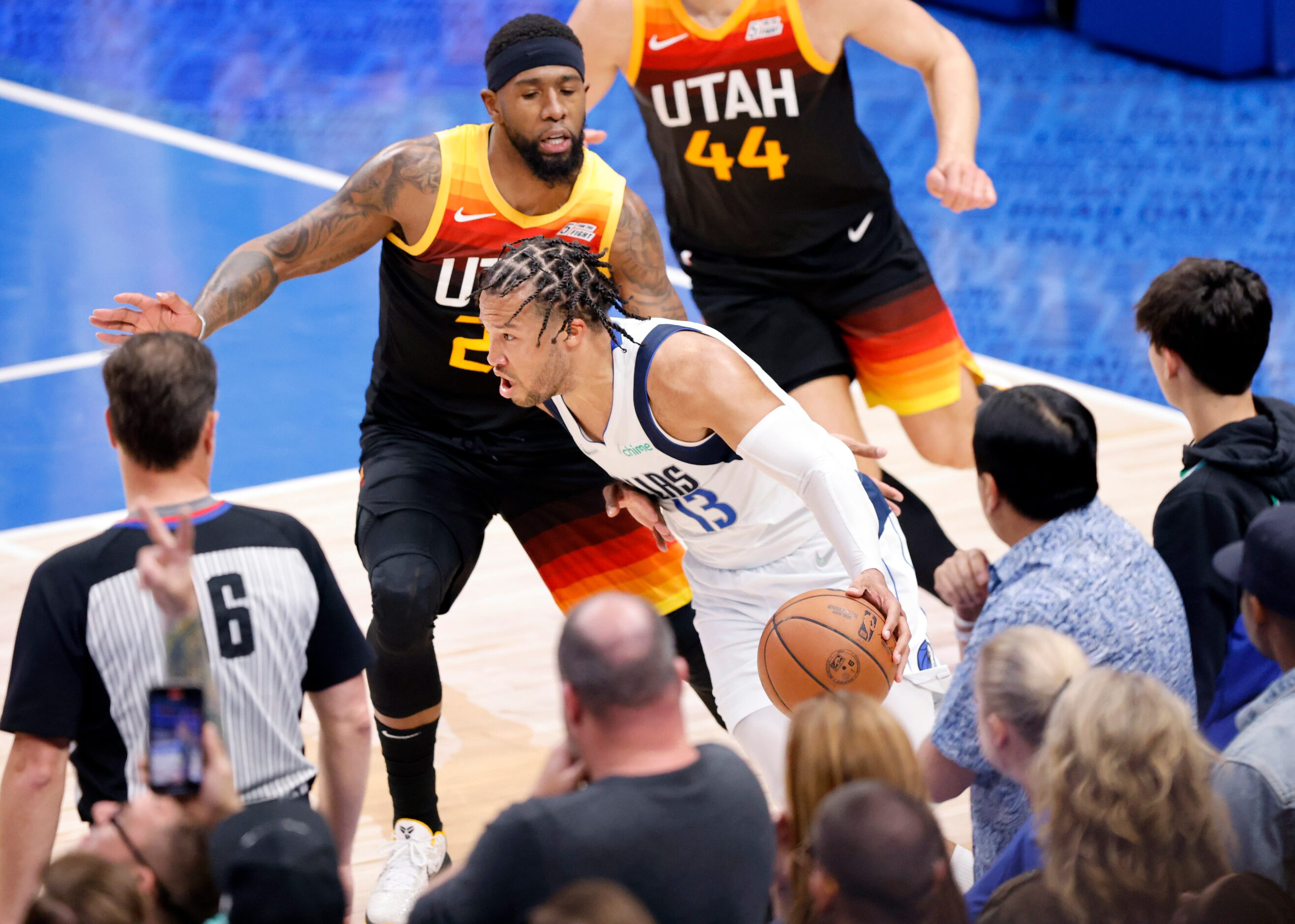 Dallas Mavericks guard Jalen Brunson (13) tries to elude the foul about to be given by Utah...