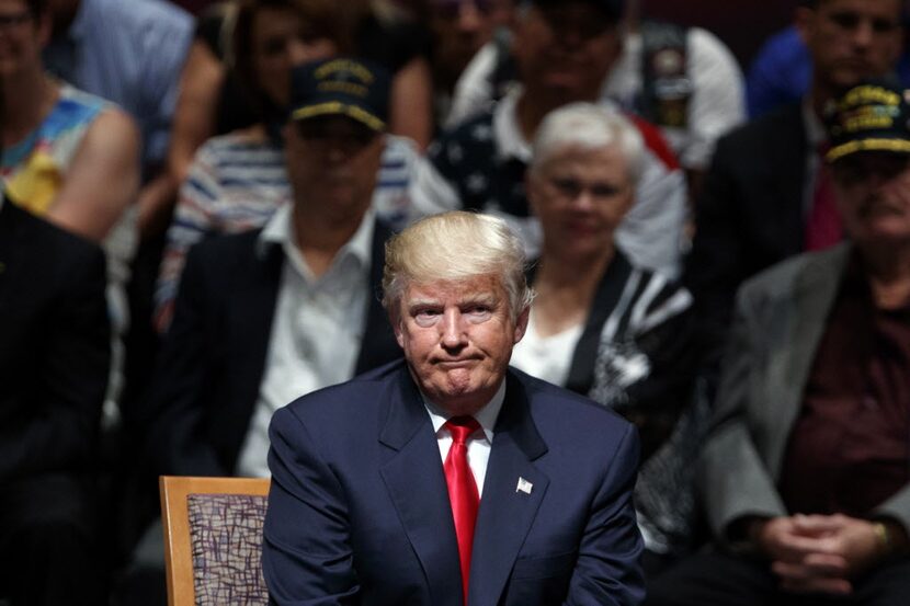 Republican presidential candidate Donald Trump pauses as he speaks during a town hall,...