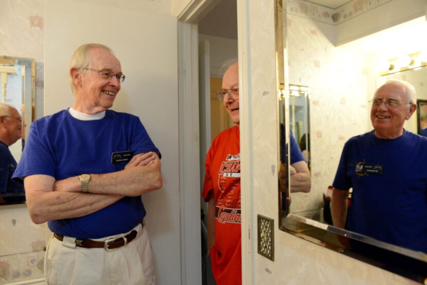 Plain-O Helpers Collins Baker (left) and Ed Sweeney (far right) chat with Plano resident Ron...