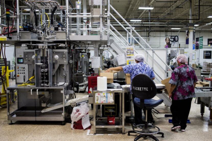 Workers at a Mary Kay Inc. manufacturing facility in Dallas.