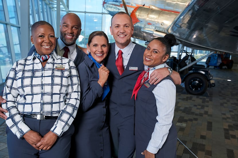 American Airlines employees wearing their new uniforms from Lands' End, which they will...