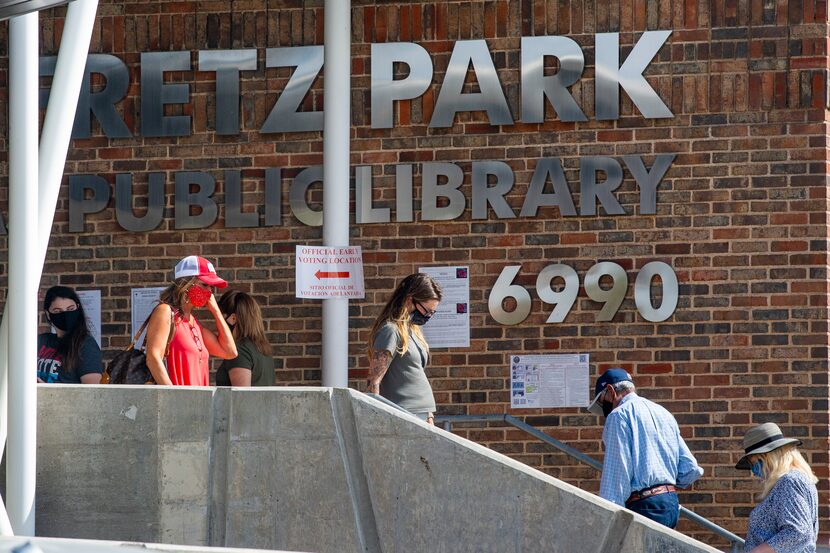 Voters line up to cast their ballot during the early voting period for the general U.S....