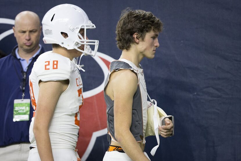 Celina quarterback Conner Pingleton walks to the lockers wearing a sling on his injured left...