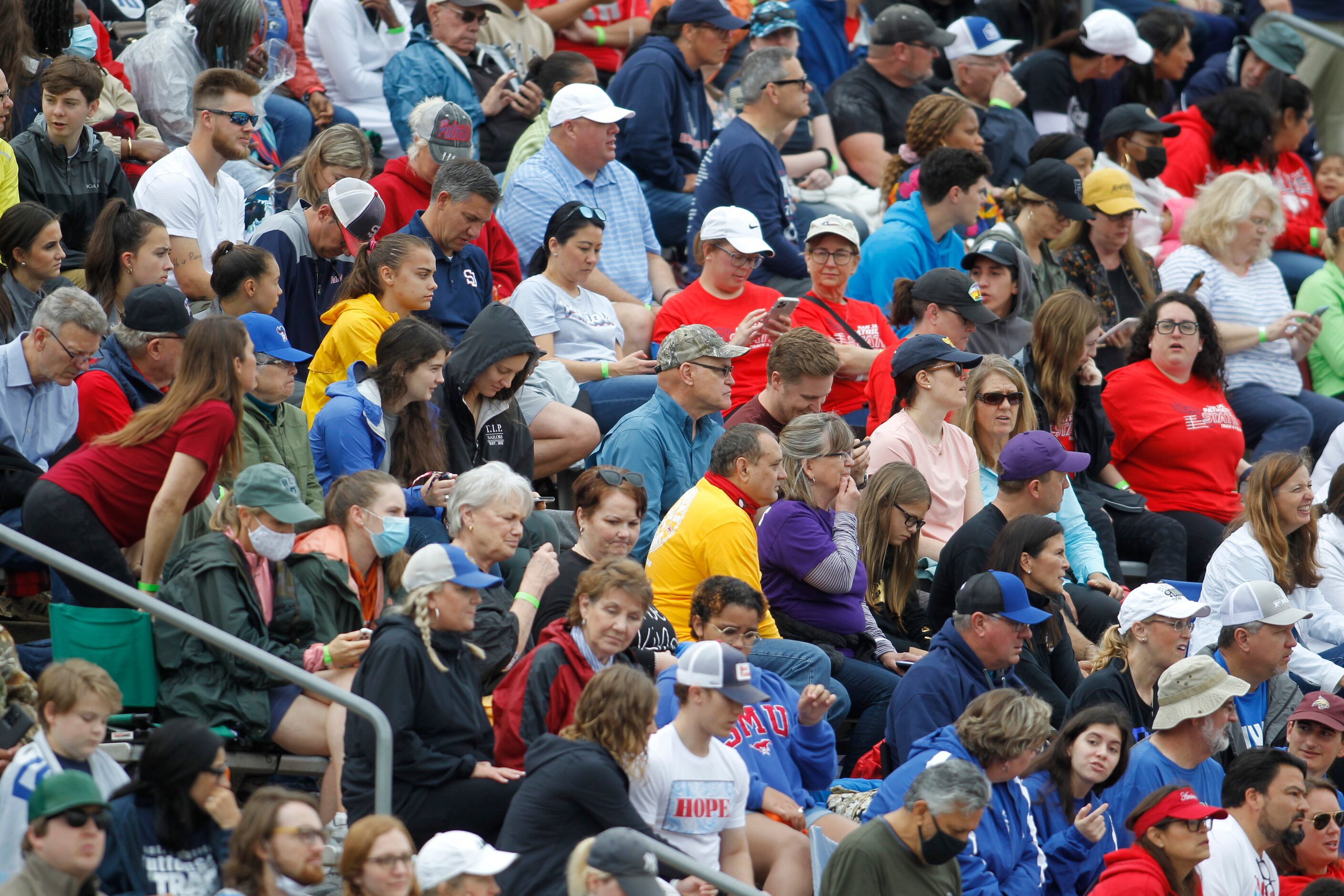 A couple of masked track enthusiasts located in the lower left corner of this photo keep the...