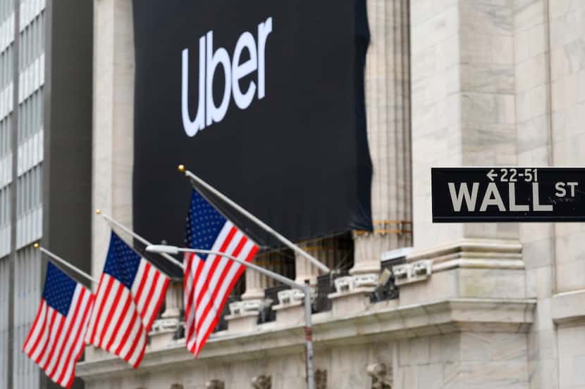 An Uber banner adorned the facade of the New York Stock Exchange ahead of the ride sharing...