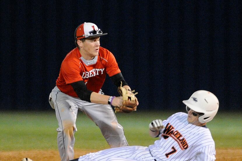 Liberty's JT Uangelder makes the tag on Wakeland's Grant Devore at second base during a high...