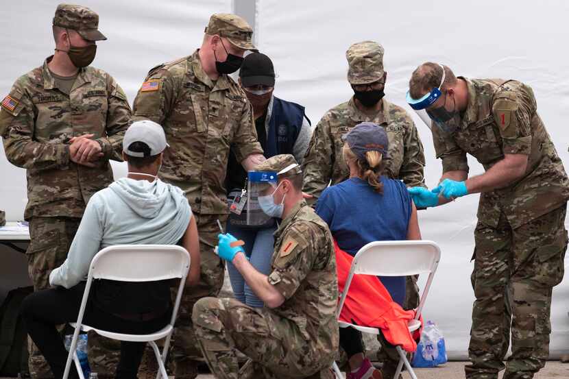 U.S. Army personnel conduct COVID-19 Vaccinations at the Dallas site at Fair Park, on...