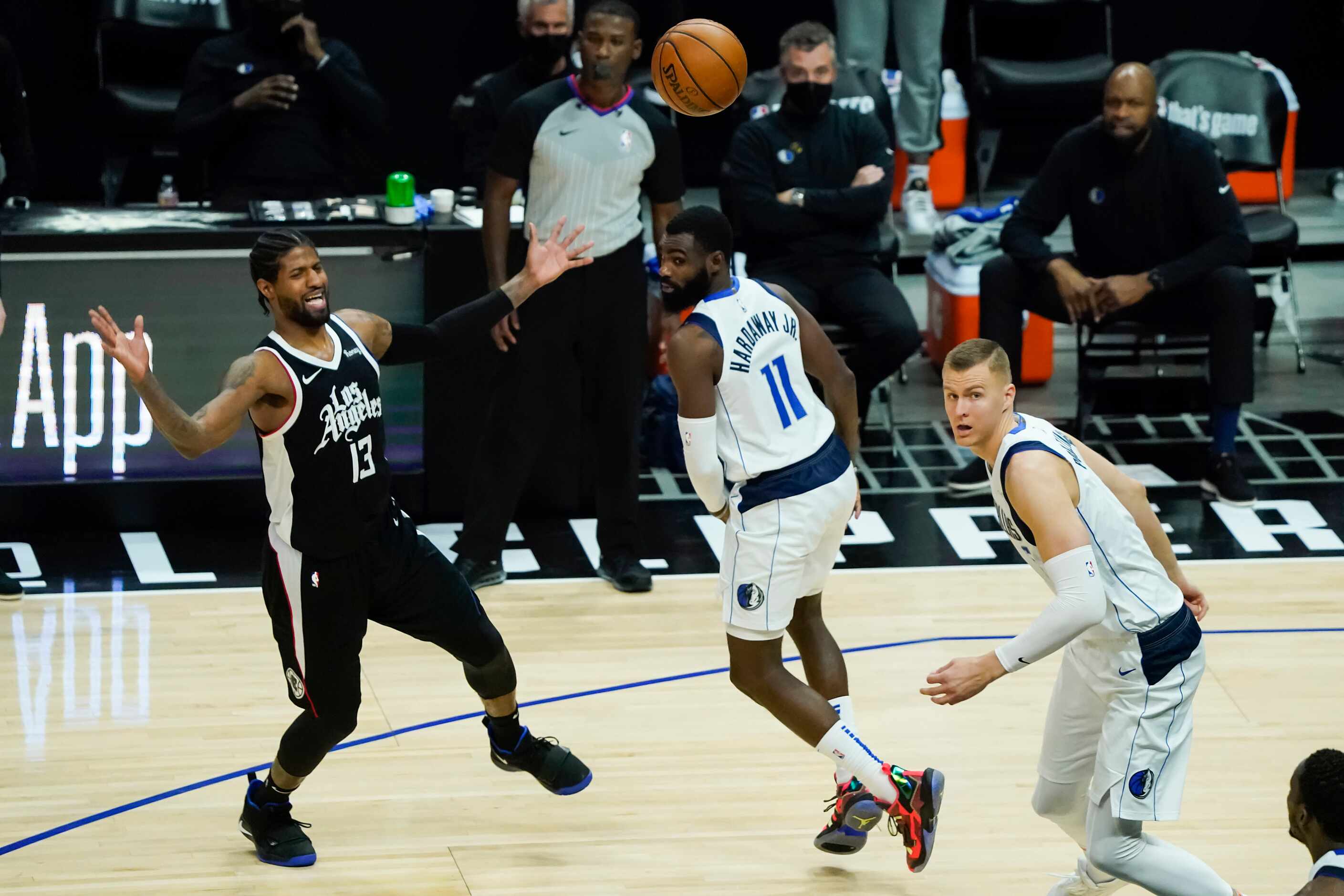 Dallas Mavericks guard Jalen Brunson (13) turns the ball over under pressure from Dallas...