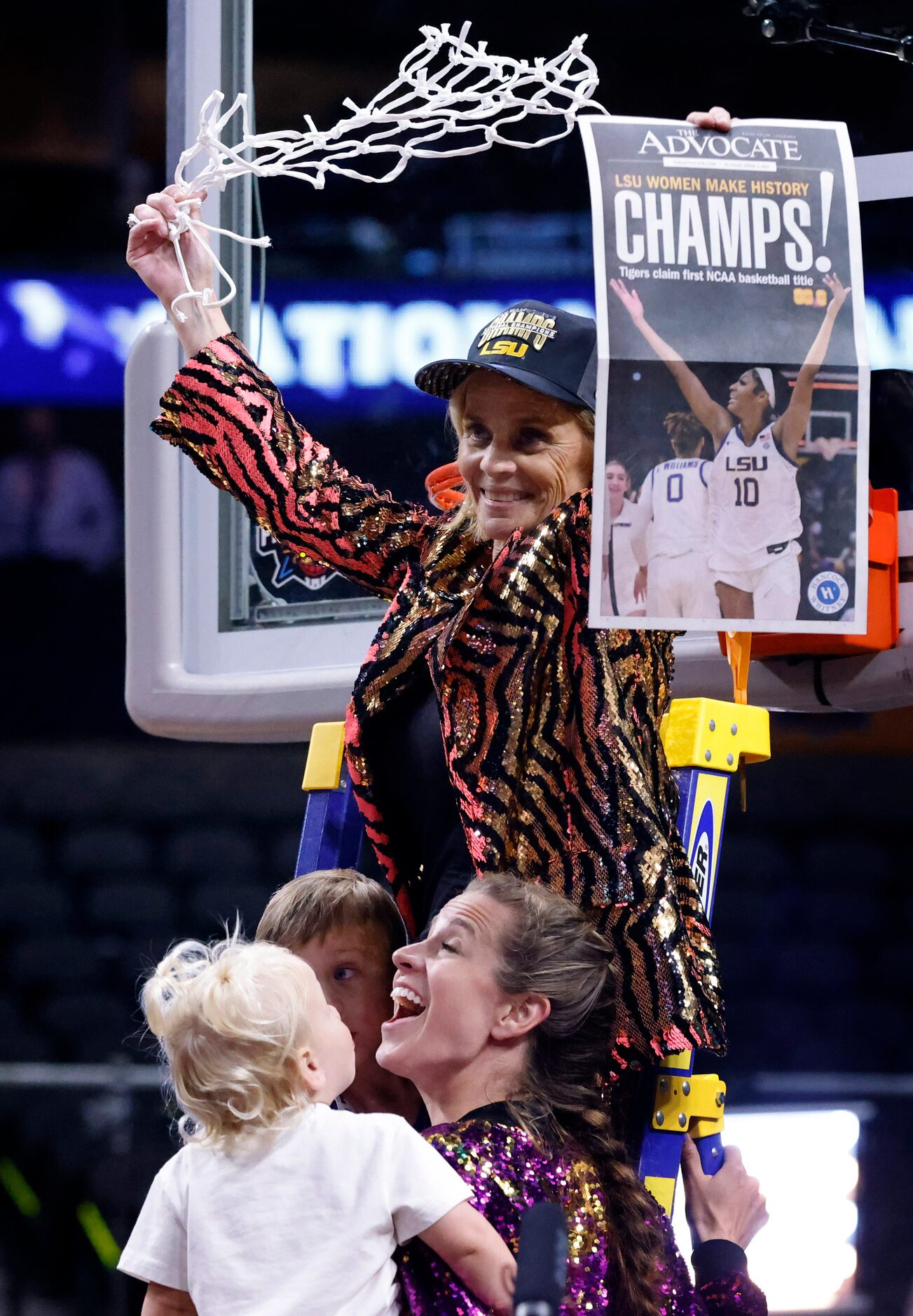 LSU Lady Tigers head coach Kim Mulkey twirls the net after cutting it down following their...