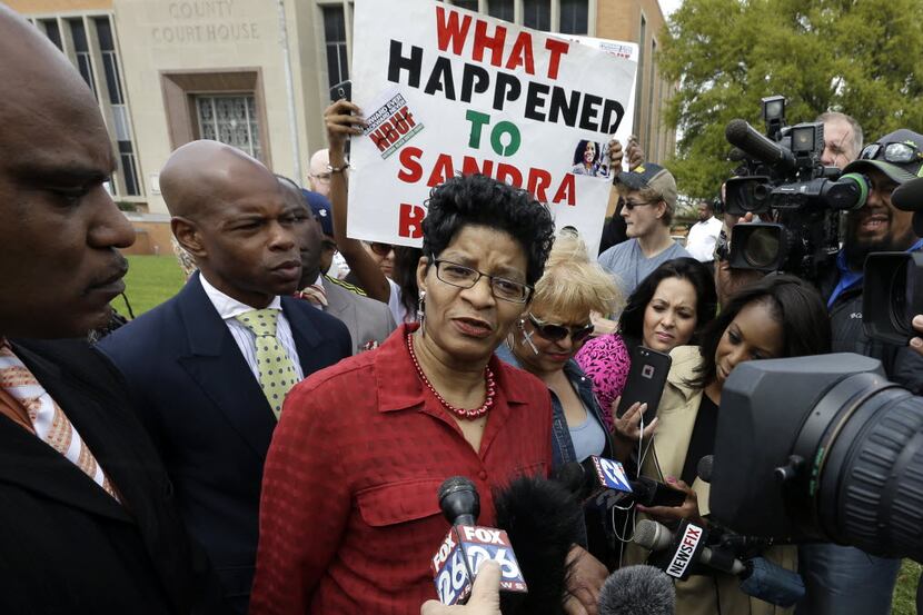 Geneva Reed-Veal, center, mother of Sandra Bland, talks with reporters outside the...