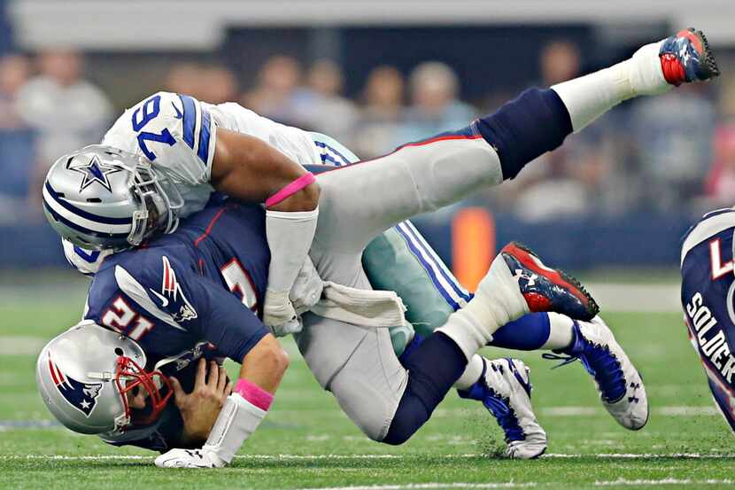 Dallas Cowboys defensive end Greg Hardy (76) sacks New England Patriots quarterback Tom...