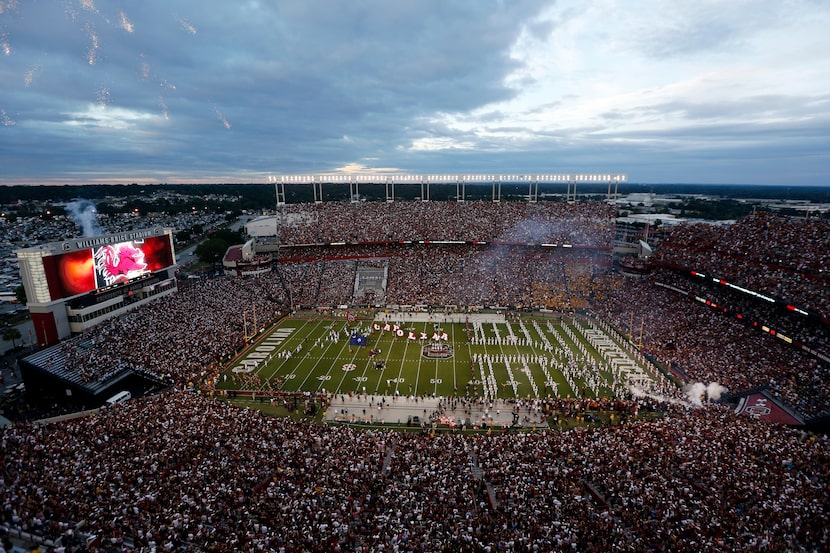 FILE - Fans cheer as South Carolina takes the field at Williams-Brice Stadium before the...