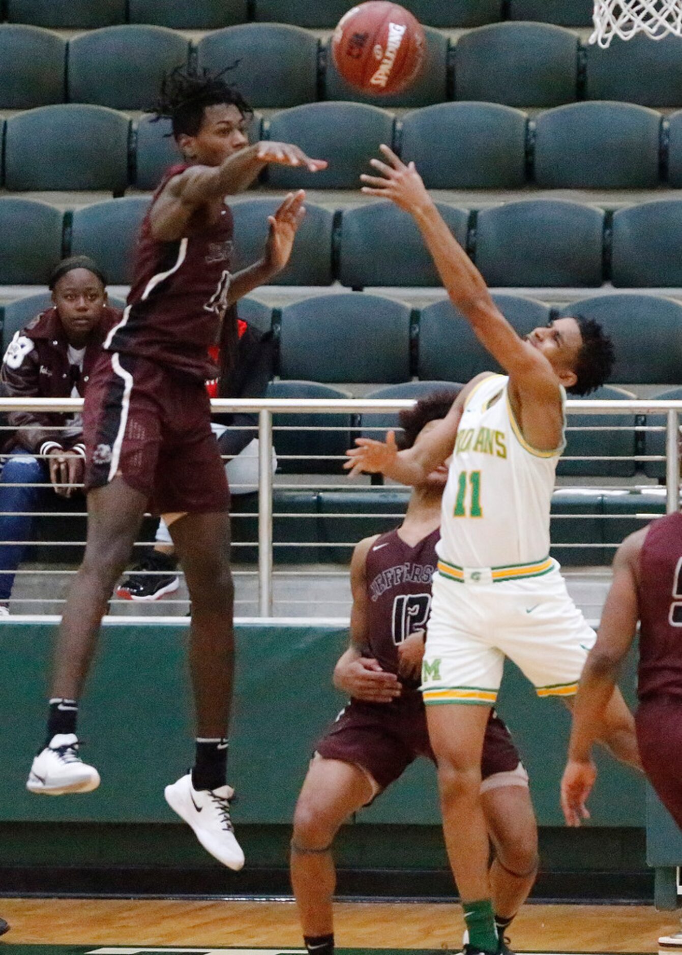 Jefferson High School forward Chrishon Hicks (10) blocks the shot attempt of Madison High...